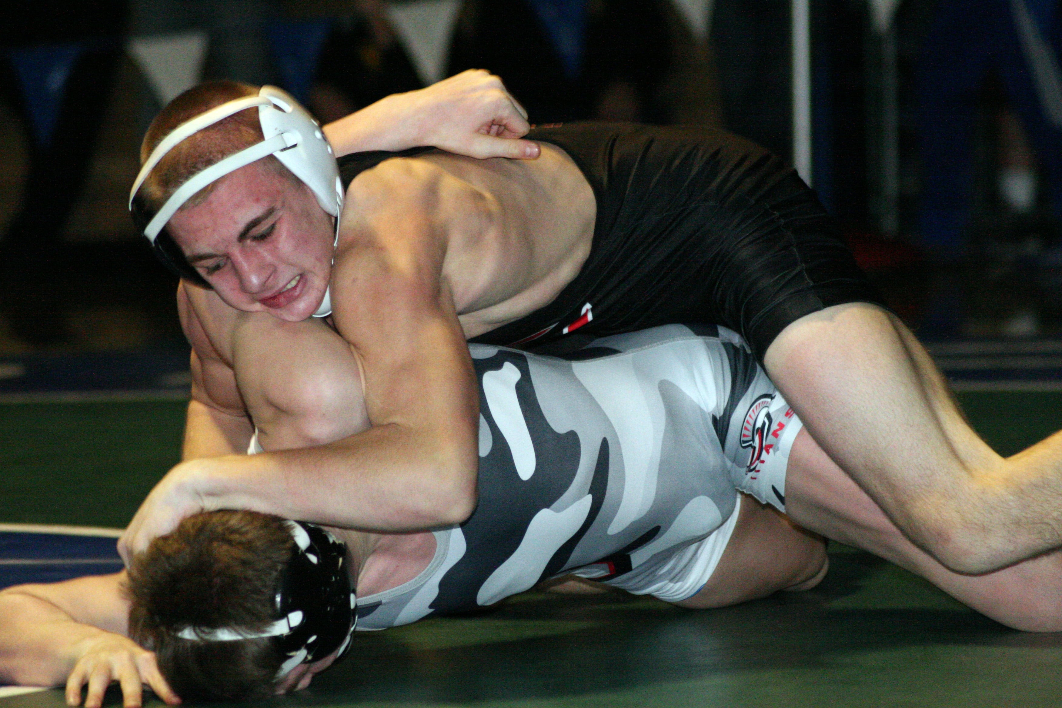 Bryant Elliott buries Daniel Rice's head into the mat. The Camas Papermaker defeated the Union Titan 15-11 to become the 132-pound Clark County champion.