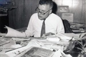 Hal is shown above at his legendary desk in his Post-Record office in April 1966, with papers displayed visibly.