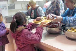 Children and adults are served complimentary dinners Monday and Thursday evenings at the Lost and Found Cafe, in the social hall at Zion Lutheran Church, in Camas. The cafe, an outreach program of the Inter-Faith Treasure House, is among several low- or no-cost meal options in Camas and Washougal. "It is wonderful being here, getting warm food," said Charles Shaver, of Washougal (not pictured).