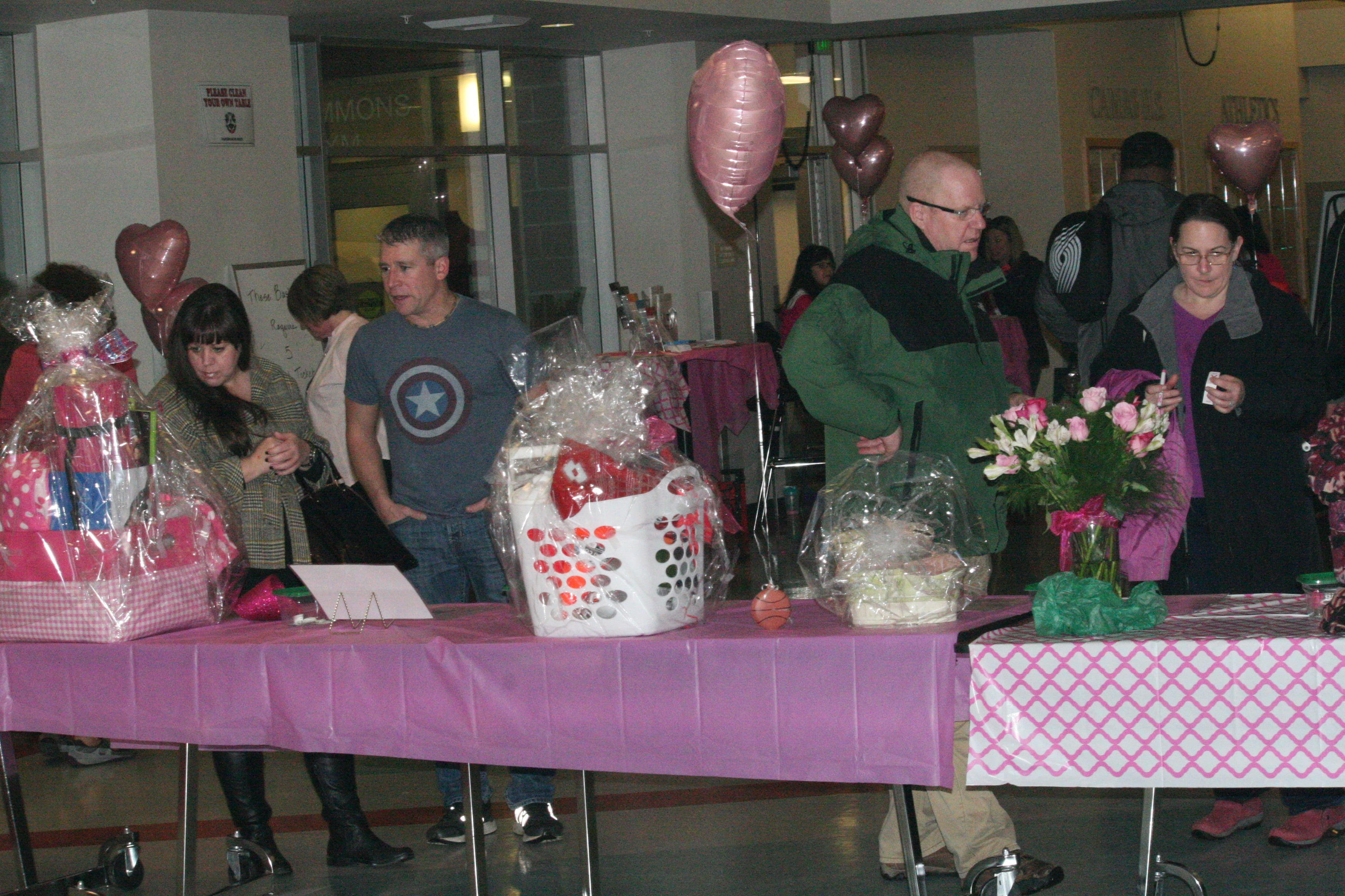 Fans check out the Hoops For Pink baskets.