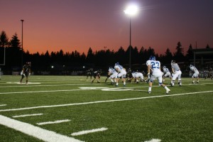 Jonathan Warner (1) and the Camas High School football players step up to the line of scrimmage against Mountain View Friday, at Doc Harris Stadium. Warner snagged two touchdown catches to help the Papermakers win 31-0.