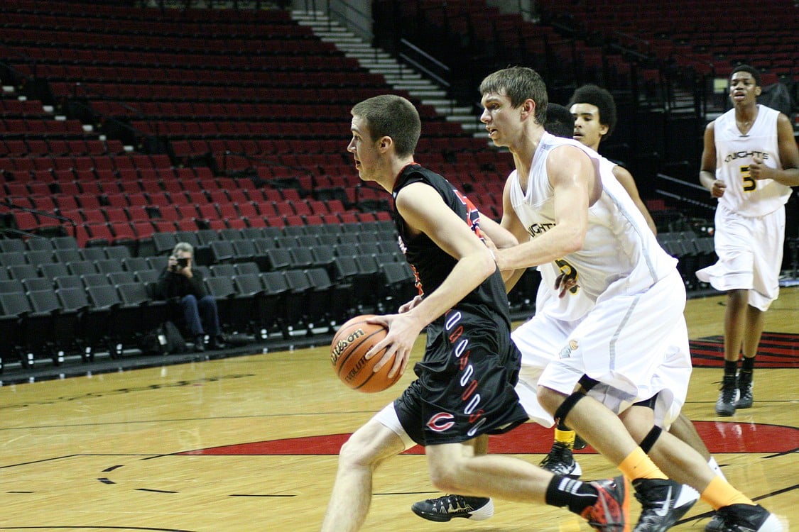 Jordan Lenard drives by the defender.