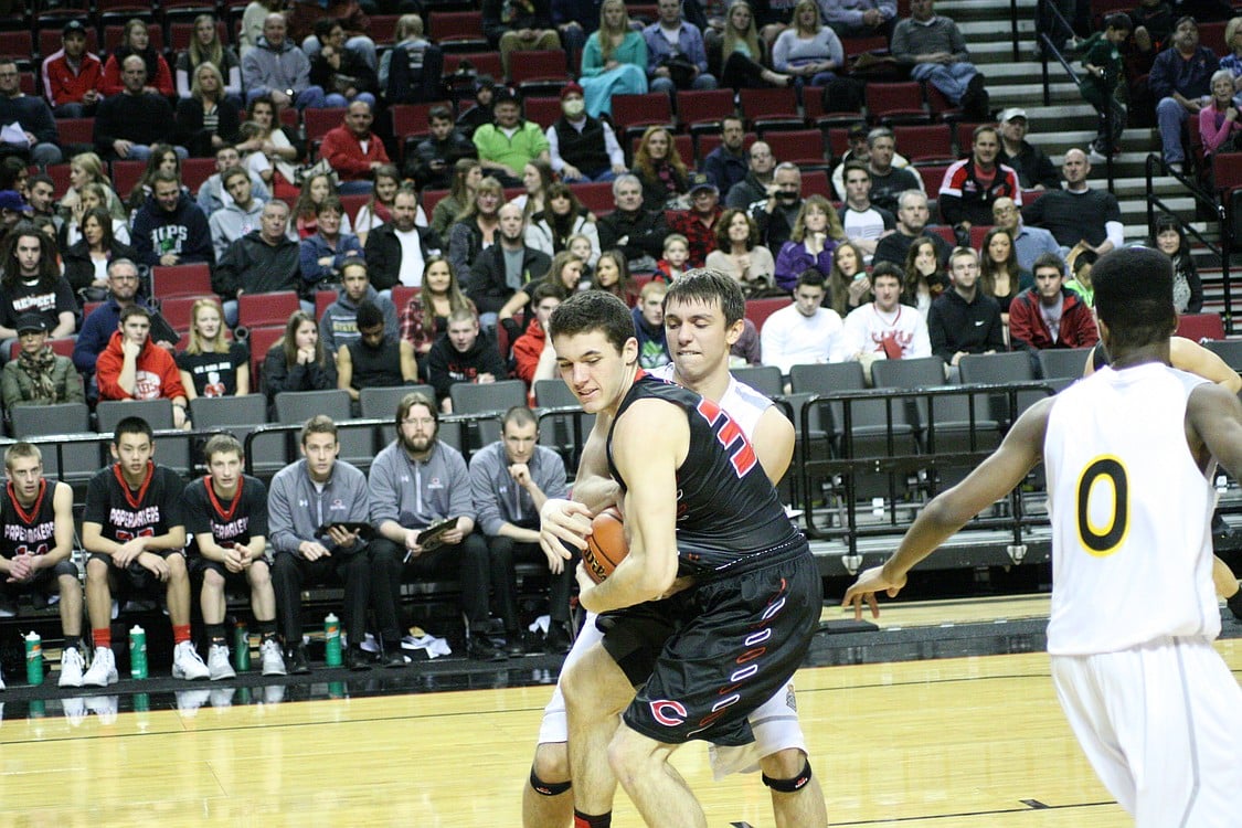 Nick Lopes fights for possession of the ball.