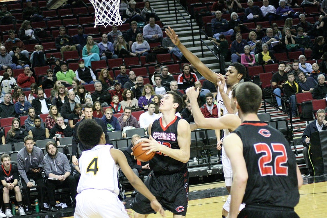 Nick Lopes challenges a defender at the net.