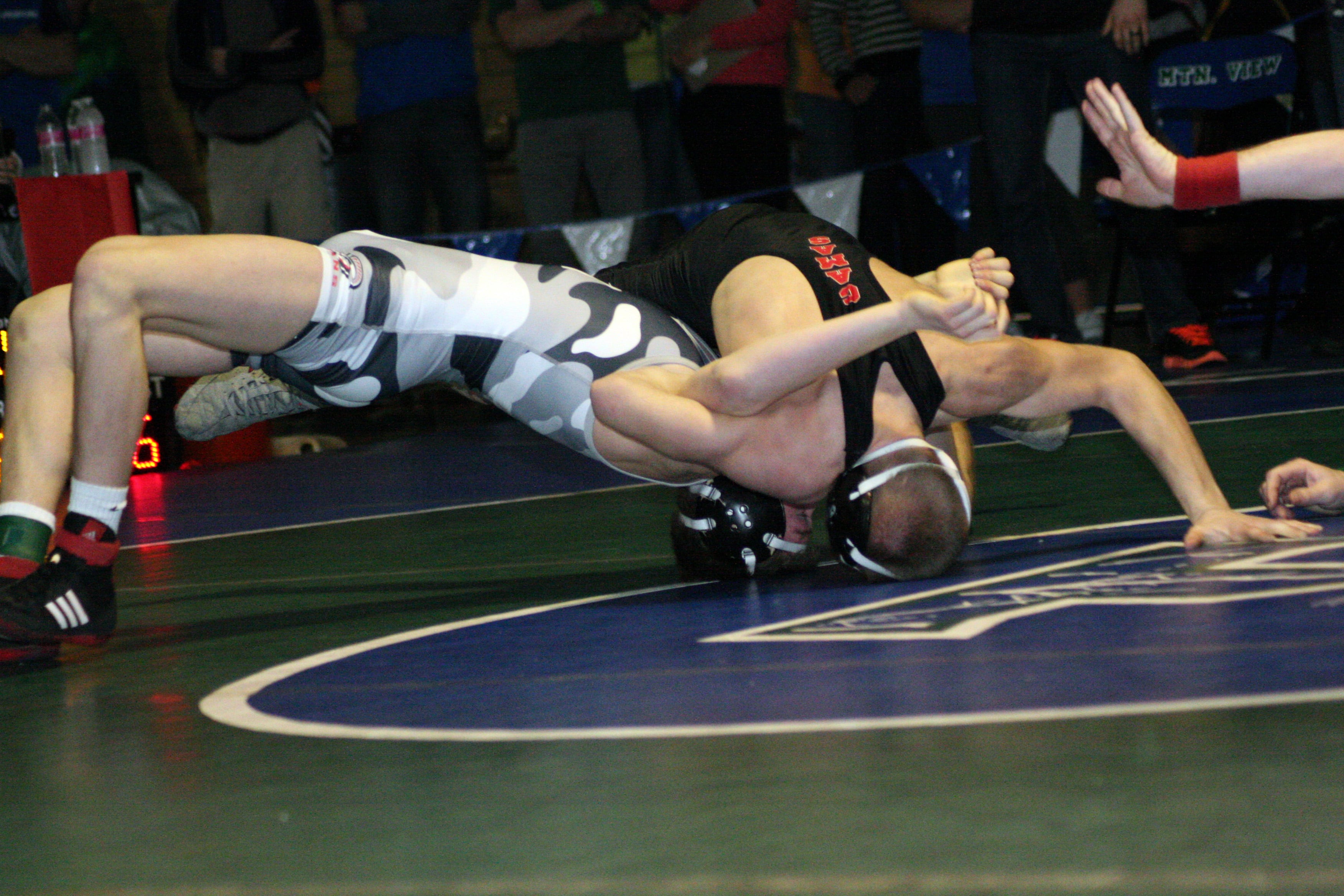 Bryant Elliott bridges over Daniel Rice.