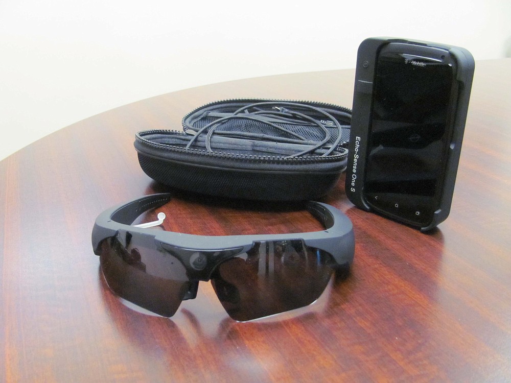 "Check Mates," enable a caregiver to see from the wearer's point of view. Audio/video information is live streamed to a caregiver on a remote computer, and the wearer can be guided through tasks.