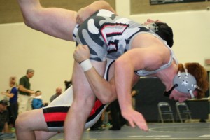 Camas High School senior Vince Huber throws Union's Cody Gromes to the mat during the 182-pound Clark County championship match Saturday, at Skyview High School. Huber held on for a 7-6 victory. See the photo gallery at www.camaspostrecord.com.