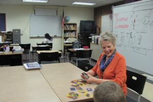 Linda Peters, a special education paraprofessional, assists an adaptive skills student at Jemtegaard Middle School. The classroom was recently upgraded, thanks to a $2,000 grant from Umpqua Bank.
