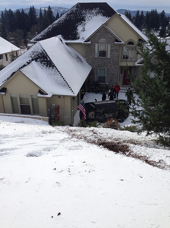 A vehicle landed in the driveway of a Washougal home after falling down a 20-foot embankment in Washougal this morning. There were no injuries.
