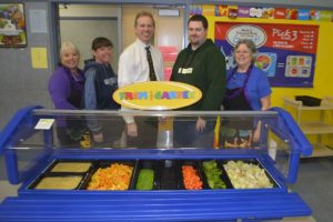 From left, Sandi Boehm, Trudi Jones, Mark Jasper, Jacob Casteel and Sandy Bell pose for a photo in the Gause Elementary School lunchroom. It is one of three Washougal schools  given "Double Gold" ratings in an audit by the National Safety Foundation.