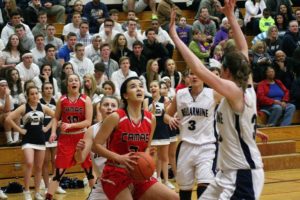 Brenna Khaw takes the ball to the hoop for Camas during Saturday's state regional game, at Puyallup High School. Bellarmine Prep took control in the second quarter and coasted to a 59-34 victory.