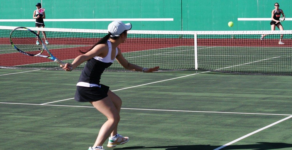 Camas High School senior Esther Kwon aims for a breaking point against Washougal High School senior Haley Briggs.
