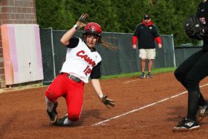 Tori O'Neill slides into home plate against Union Wednesday, at Camas High School. The Papermakers outperformed the Titans 10-8.