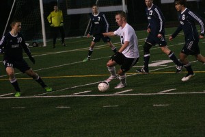 Joseph Snedeker draws the attention of four Hawks and the goalkeeper. The Washougal junior netted two penalty shots to help the Panthers beat Hockinson 3-2 Monday, at Fishback Stadium.