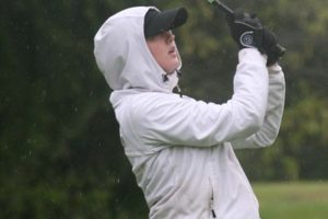 With blurry vision created by relentless rain drops, Molly Bilsborough lands her tee shot on the 17th green of the Lewis River golf course Thursday. The CHS senior won the Chieftain Invitational's closest to the pin challenge on this hole.