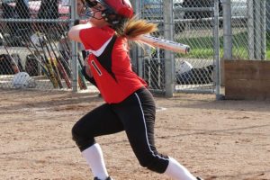 Lena Richards rips a triple into the left field corner April 29, at Camas High School.