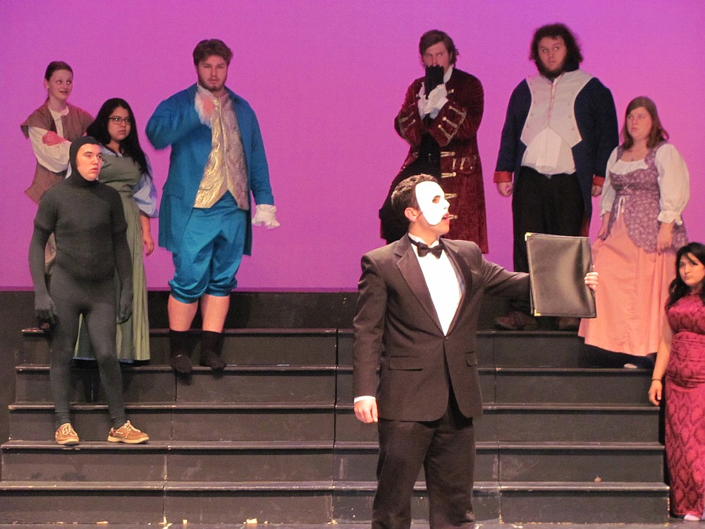 The Phantom  causes a commotion among the guests of the Masquerade.