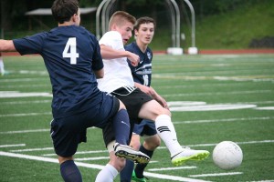 Bennett Lehner kicks the soccer ball beyond two Skyview defenders Saturday, at McKenzie Stadium. Lehner netted the tying goal for Camas in the first half. Skyview clinched the district title on a 4-3 shootout victory.