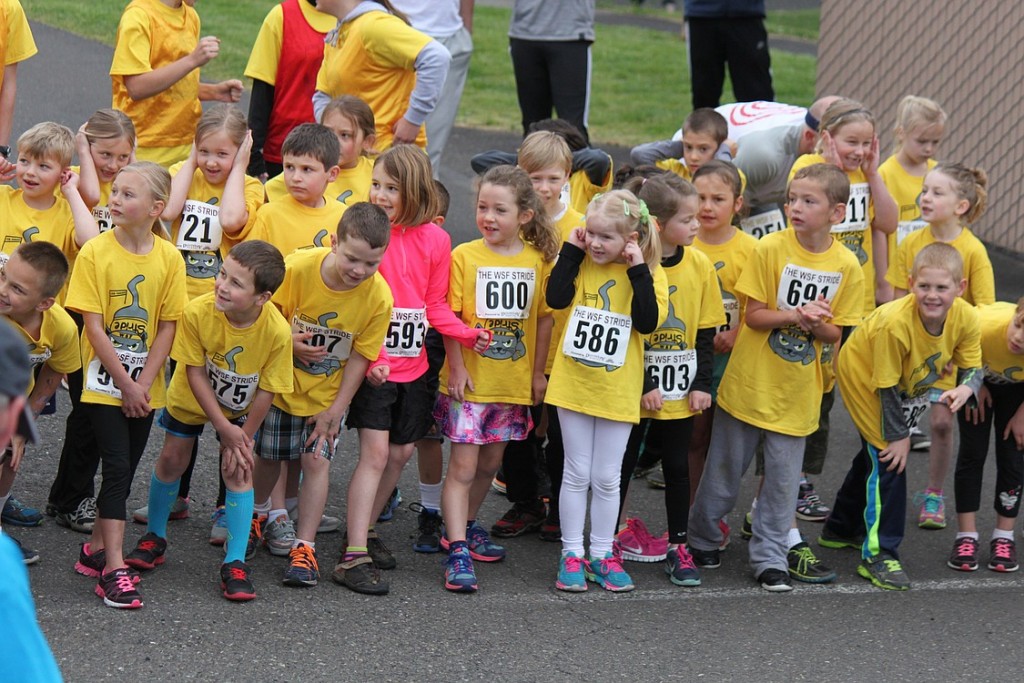First-graders gather at the starting line with excitement (and trepidation), as they wait for the air horn to sound, marking the start of the 1.5 K race. Saturday's events included a 5K run/walk, open to the public, and five grade level races in addition to the Dash, a quarter-mile race for kids in preschool and younger. According to organizers, the community event promotes fitness and learning.