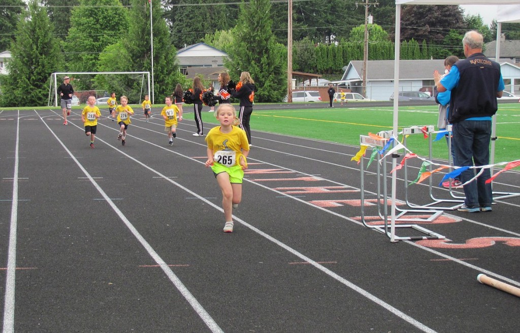 Maddy Alldrin (265) pushes to the finish line during the kindergarten race at Saturday's Washougal Schools Foundation Student Stride for Education. She ran 1.5 kilometers 7 minutes, 20 seconds. All proceeds from the annual event, which included a 5k run/walk as well as student races, benefit local schools.