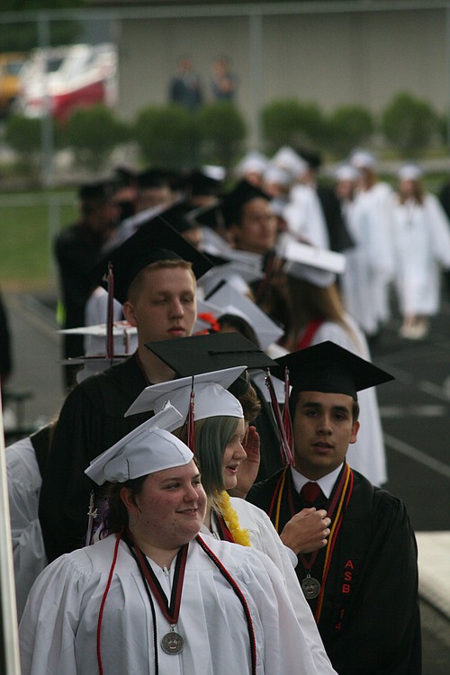 Although rain fell most of the day, the skies stayed clear for graduation night at Doc Harris Stadium. Here, CHS seniors wait for the ceremony to begin.