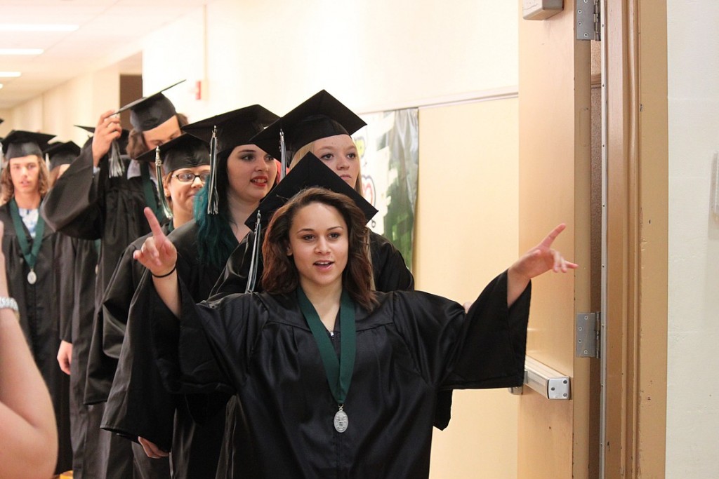 Kaylee Justice, Christine Crandall and Tiffani Pekkala lead a line of seniors as they walk into the gymnasium, where they would soon become graduates of Hayes Freedom High School. The Camas School District's alternative school had 40 seniors graduate during ceremonies at Liberty Middle School on Saturday.