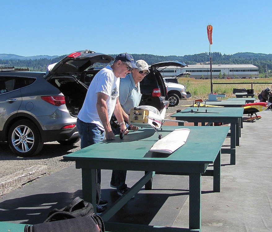 Jim Brewster (left) and Joiner inspect Brewster's model of a Cessna 182. Brewster, a licensed pilot, used to fly Cessnas.