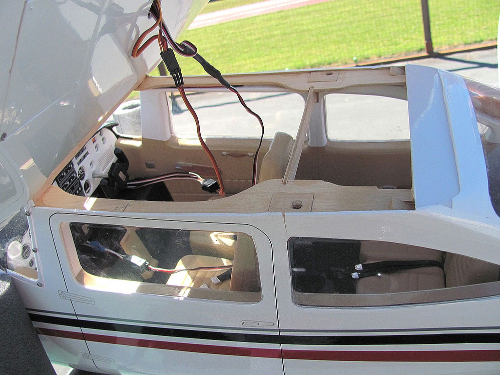 This model Cessna 182 includes intricate interior details, such as foot rests, controls and maps.