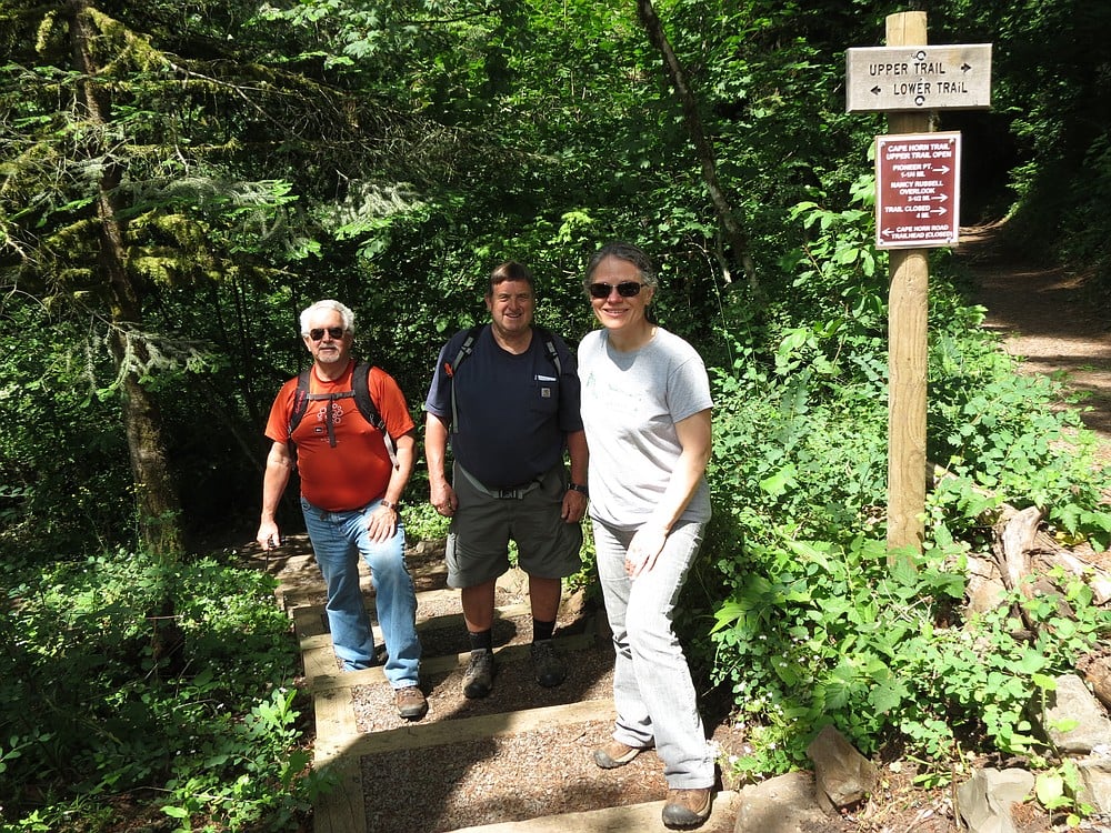 Cape Horn Conservancy President Teresa Robbins, board member Larry Keister and Friends of the Columbia Gorge Secretary Keith Brown stand on a new set of stairs leading hikers out of the Cape Horn Trail. The log curbs, fabric underneath and gravel on top prevent the build up of mud.