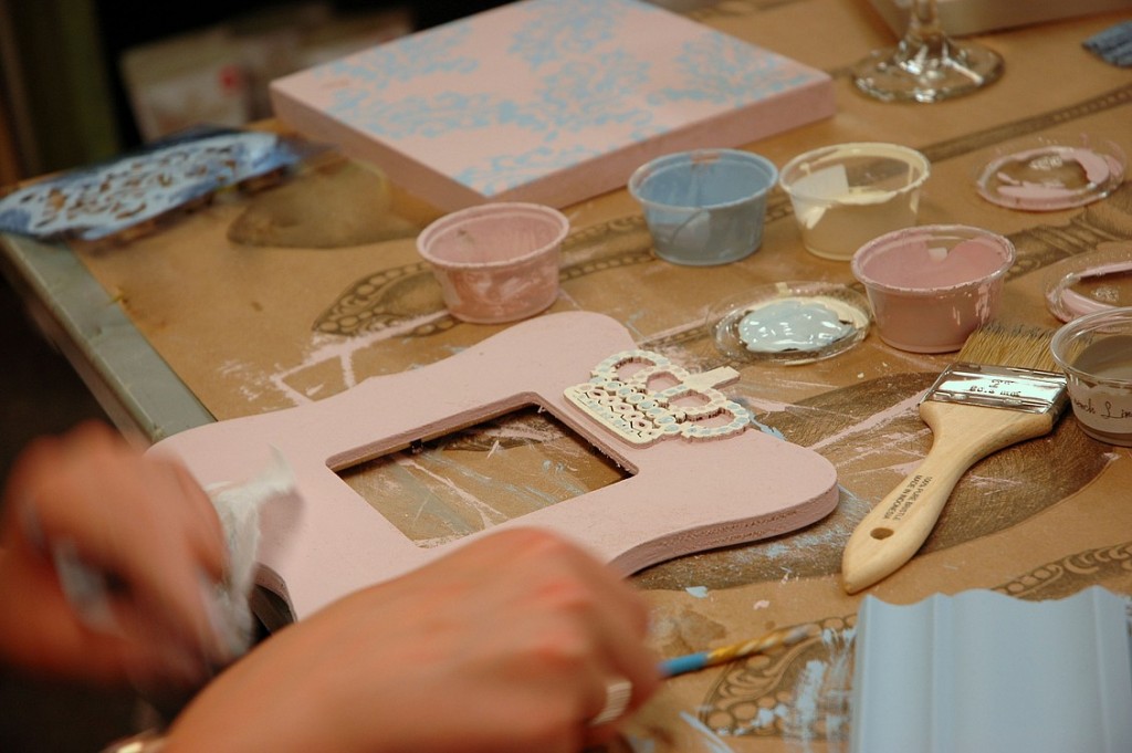 A workshop participant puts the finishing touches on a picture frame.