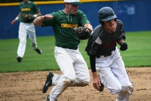 Camas-Washougal Granite's Braden Devlin tags out the runner caught in a pickle between first and second base Thursday, at Kindsfather Field across the street from Clark College.