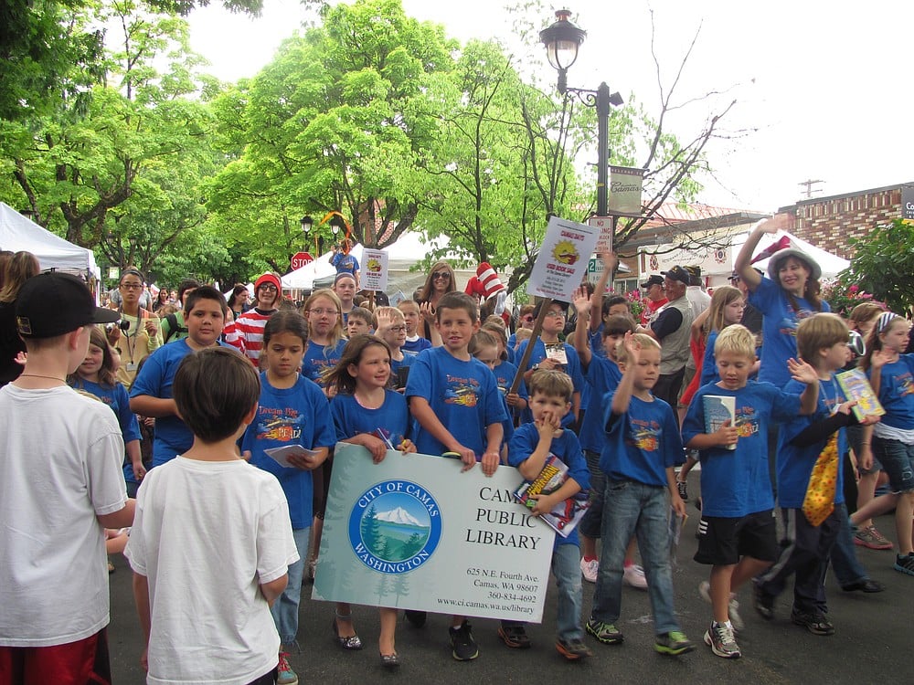 Participants in the Camas Public Libarary's summer reading program marched in the Kids Parade holding books and wearing library T-shirts.