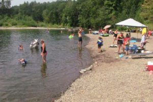 Area residents spent time at the Sandy Swimming Hole Monday, enjoying picnics, sunbathing, rafting and cooling off in the Washougal River, as temperatures neared 100 degrees. Last night, the Washougal City Council voted 4 to 2, against purchasing land from Riverside Seventh-day Adventist Church to create a park and overflow parking for users of the Sandy Swimming Hole.