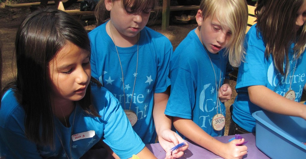 Junior Scouts create dreamcatchers at Currie Twilight Camp last week. The J.D. Currie Youth Camp is located on 300 acres just outside of Camas and is home to several different youth events during the summer.