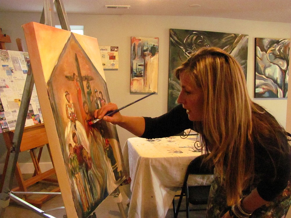 Field puts the finishing touches on a commissioned piece she created for the wife of a local firefighter. He sketched out a rough design and Field created the painting from his ideas.