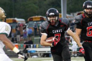 Camas High School senior Nate Beasley (7) gallops to the first of five touchdowns Friday, at Doc Harris Stadium. The Papermakers beat Jesuit 47-14 in a battle of the top teams in the largest classifications of Washington and Oregon.