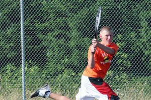 Regan Townsend backhands the ball for Washougal Friday, on the Camas tennis court. The Papermakers defeated the Panthers 5-1.