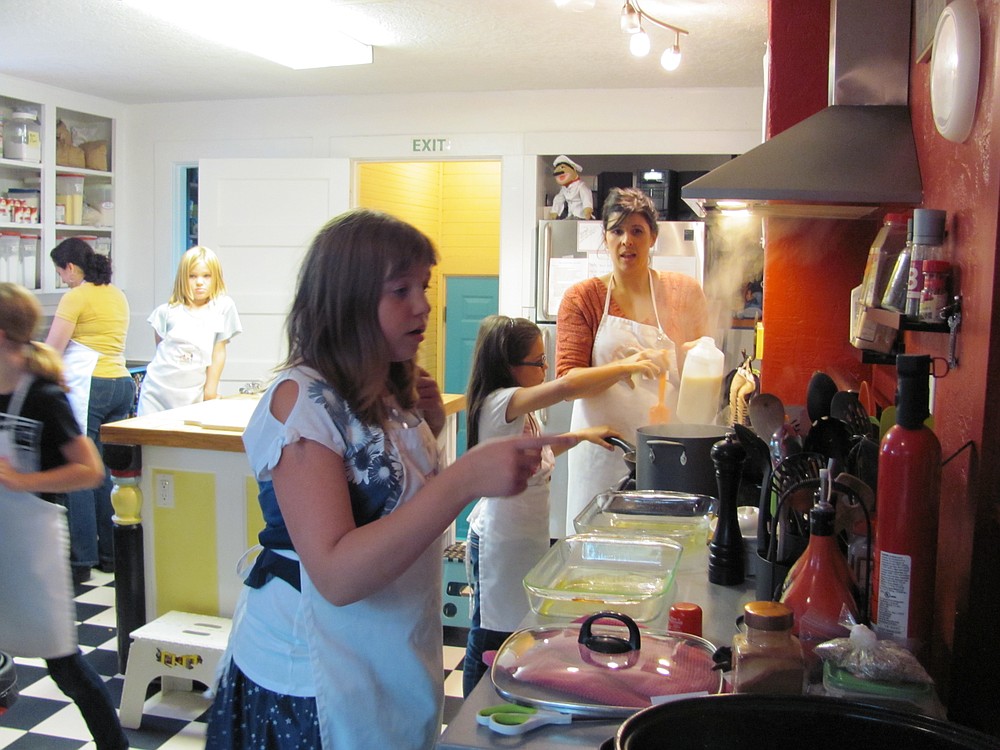 Danielle Frost/Post-Record
Everyone helps at The Kids Cooking Corner. Volunteers supervise as the children stir, slice, dice and chop various foods.