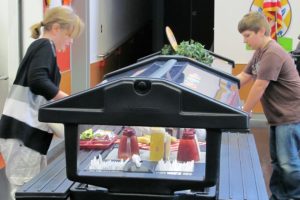 Students make selections from the vegetable and fruit bar at Helen Baller Elementary School. The Camas School District won a national award for its nutrition program.