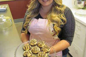 Bethani Higdon shows examples of chocolate cupcakes at the future site of WildFlour Cafe & Cupcakes. "It's all from scratch," she said. "Nothing is from a box." Bethani and her mother, Connie, plan to open the cafe in Washougal Town Square this Friday. "She loves to bake and cook," Connie said. They will serve sandwiches, soups, salads and ice cream.
