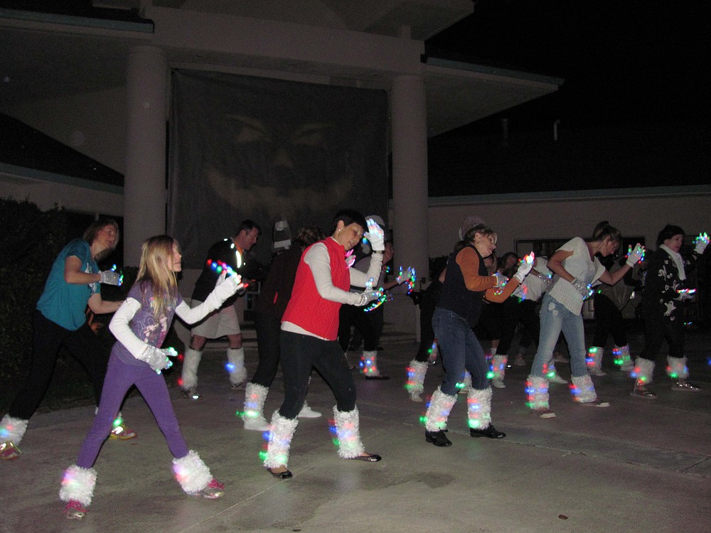 Lacamas Shores neighbors practice for an upcoming Halloween night performance of "Thrill the World," at Steve and Sarah Bang's home in Camas. The group, plus or minus a few members, has been performing the dance for five years.
