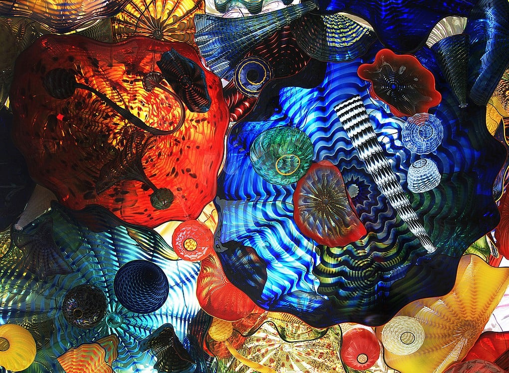 This view, looking up, shows many of the glass objects in the ceiling of the Chihuly Bridge, outside the Museum of Glass in Tacoma, Wash.