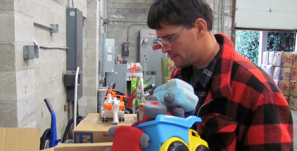 Mark Lockwood, a volunteer, sorts through toy donations in a warehouse at River Rock Church, in Camas. The items, as well as clothing and shoes for men, women and children, will soon be sent to people affected by Typhoon Haiyan, in the Philippines. Donations of bedding, hand sanitizer, bandages, diapers, school supplies, pots, pans and tarps, are accepted at River Rock through Saturday, Dec. 7. "The storm was an act of nature," said Tony Williamson, a pastor. "We want our response to be an act of God."