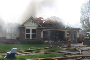 Firefighters from several agencies responded to a structure fire in Camas Tuesday afternoon. Alan Murray, co-owner of the home at 3627 N.W. Sierra Drive, said his son Brian accidentally started the fire on the deck.