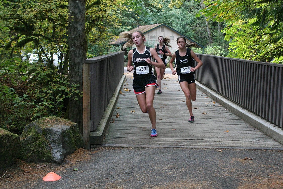 Maddie Woodson and Alissa Pudlitzke chase Alexis Fuller of Union.