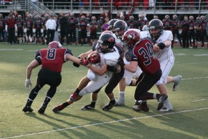 Nate Beasley follows behind the offensive line to gain a first down. Camas defeated Eastlake 47-28 Saturday, in Sammamish, to return to the Tacoma Dome for the third football season in a row.