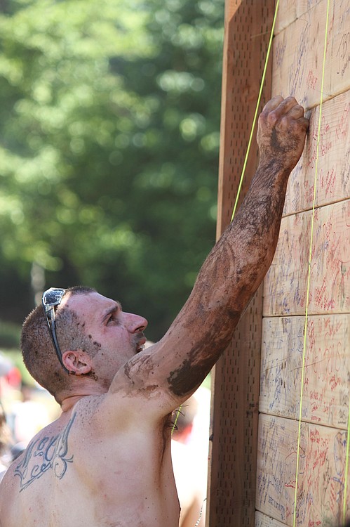 Spartan Race finishers sign the "Wall of Fame" after completing the extreme obstacle course race on Saturday, July 16, at Washougal Motocross Park.