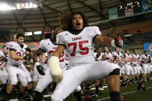 The Papermaker football players get the Camas crowd roaring with their tribal dance Friday, at the Tacoma Dome.