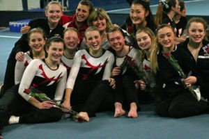The Camas High School gymnasts and coaches are all smiles after becoming district champions Wednesday, at Northpointe in Vancouver.