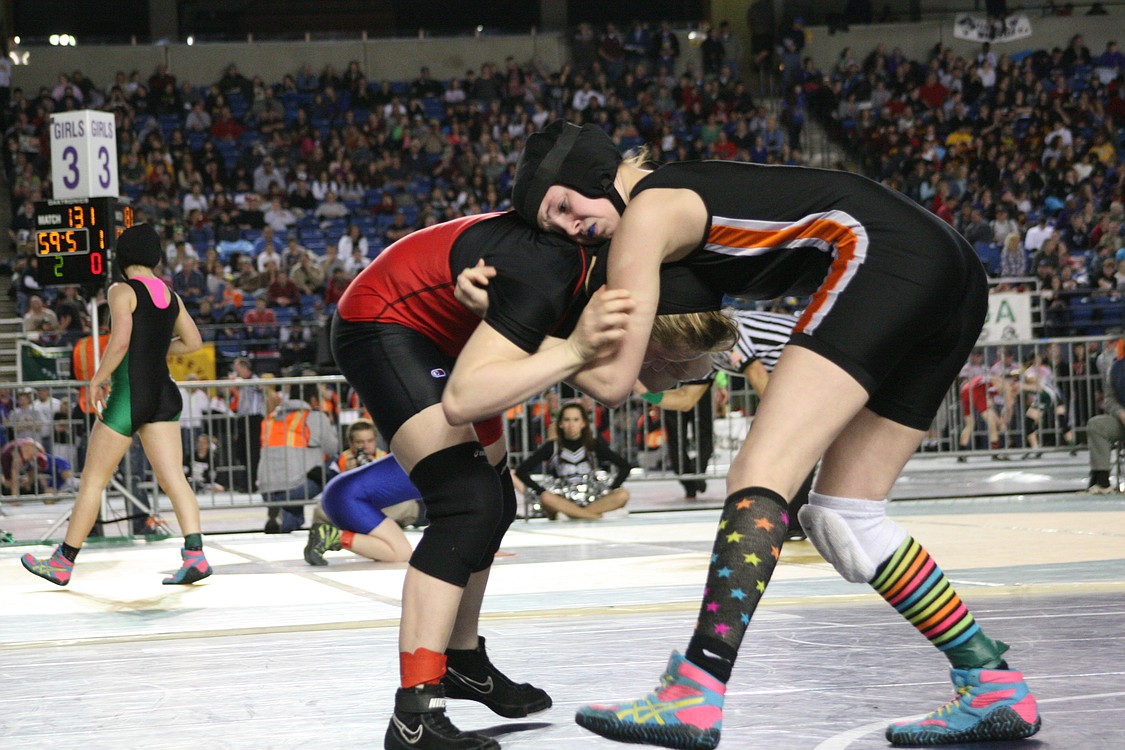 Haven Camden shows off her lucky socks at the Tacoma Dome.